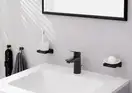 Смеситель для раковины 100 Hansgrohe Logis (цвет - чёрный матовый), с металлическим сливным гарнитуром 71171670
